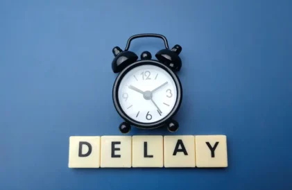Clock that indicates FAFSA delays.